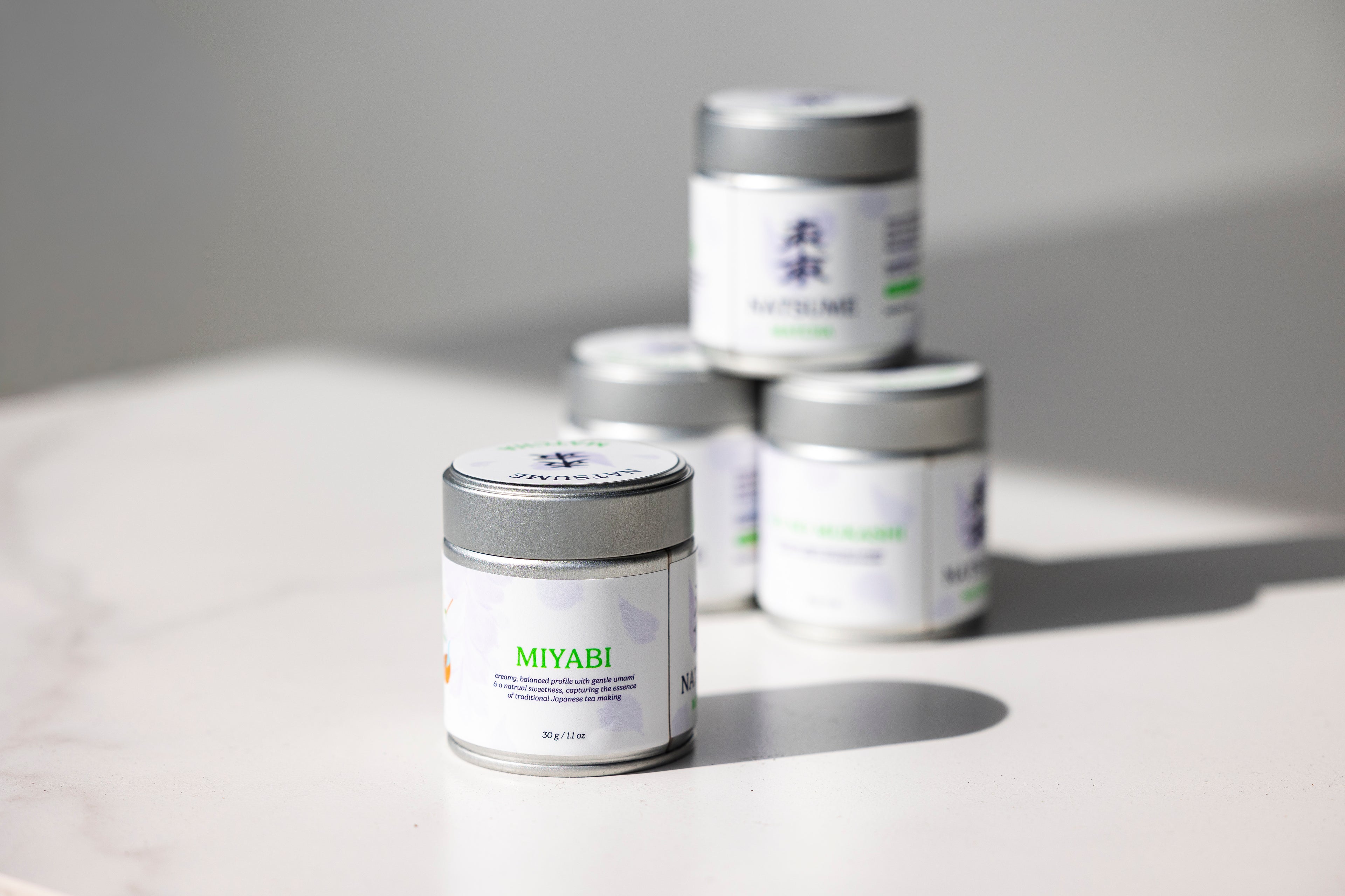 Natsume Matcha Miyabi products on a light surface with a neutral background